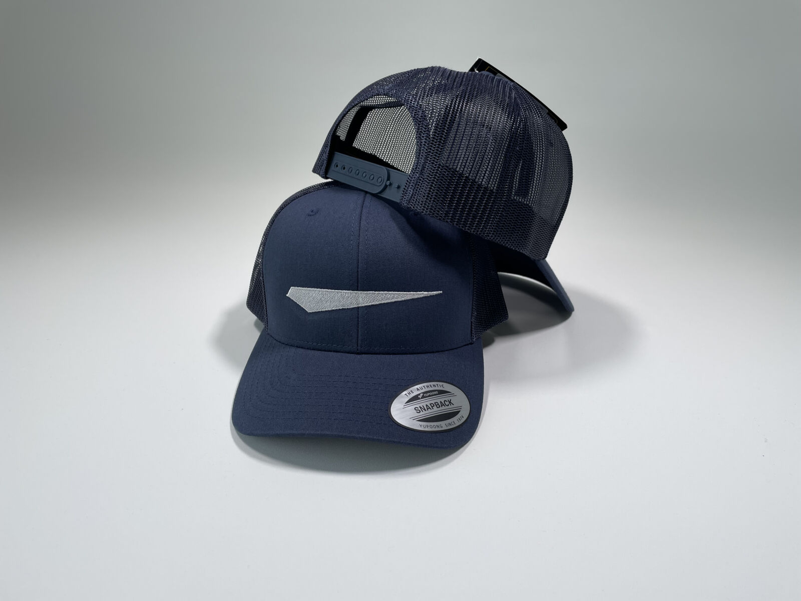 Dark blue trucker caps with embroidered company logo