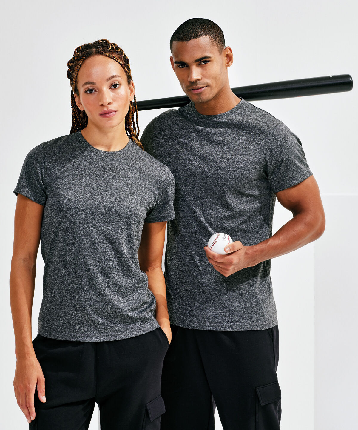 Man and women wearing dark grey performance fabric t-shirts