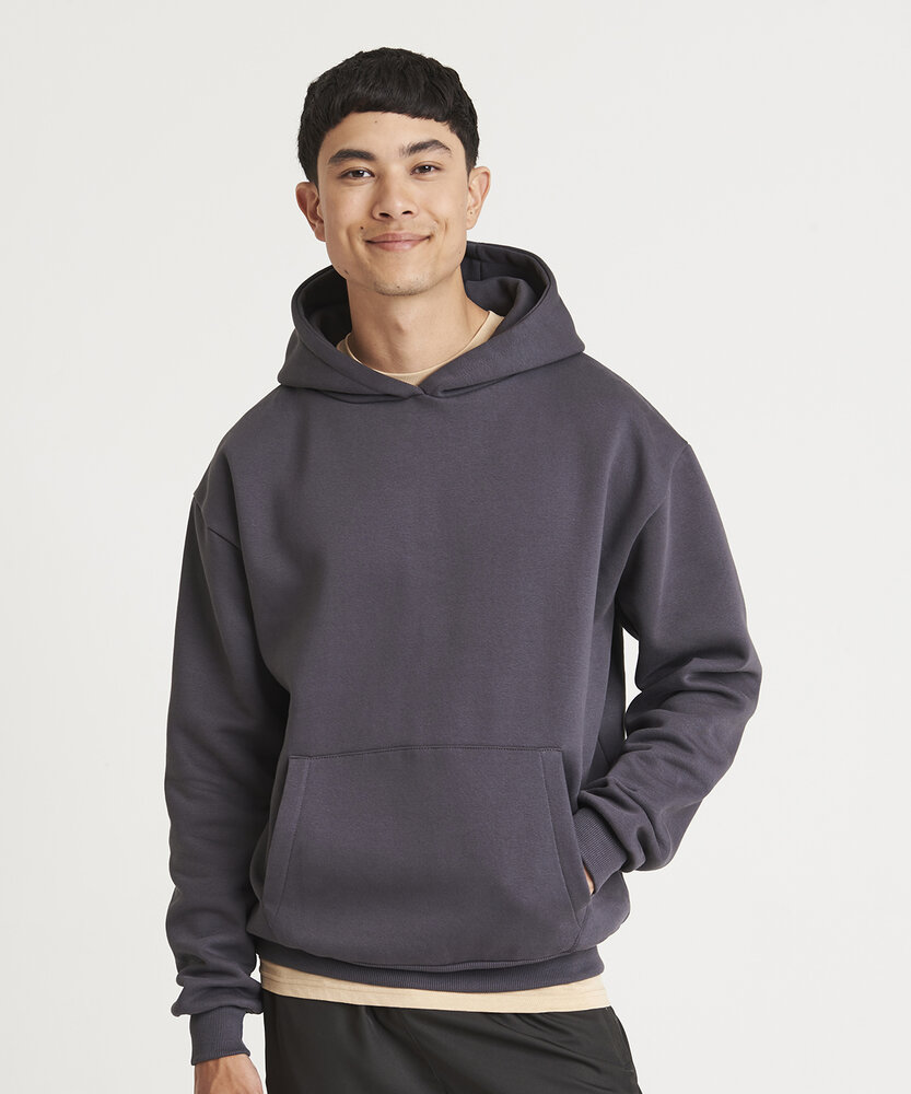 Man wearing oversize hoodie in grey