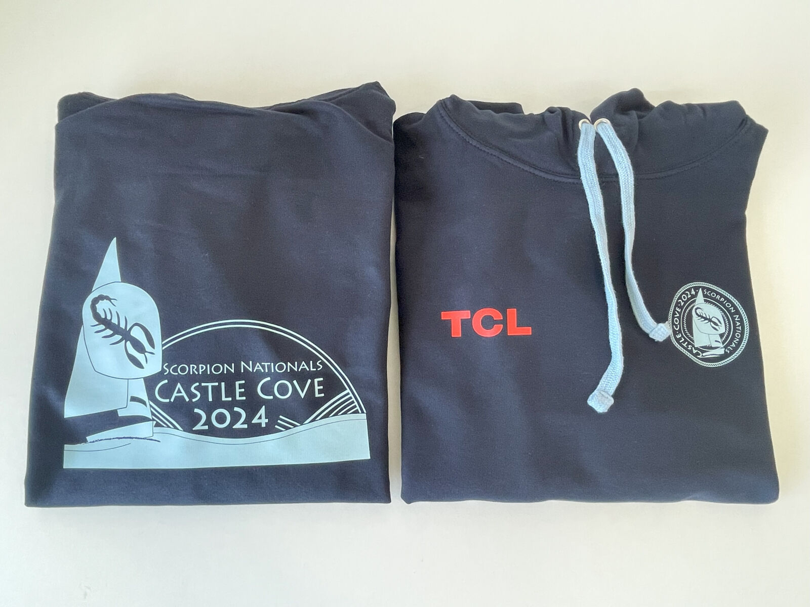 Dark blue hoodies with contrast light blue cord printed with detailed design